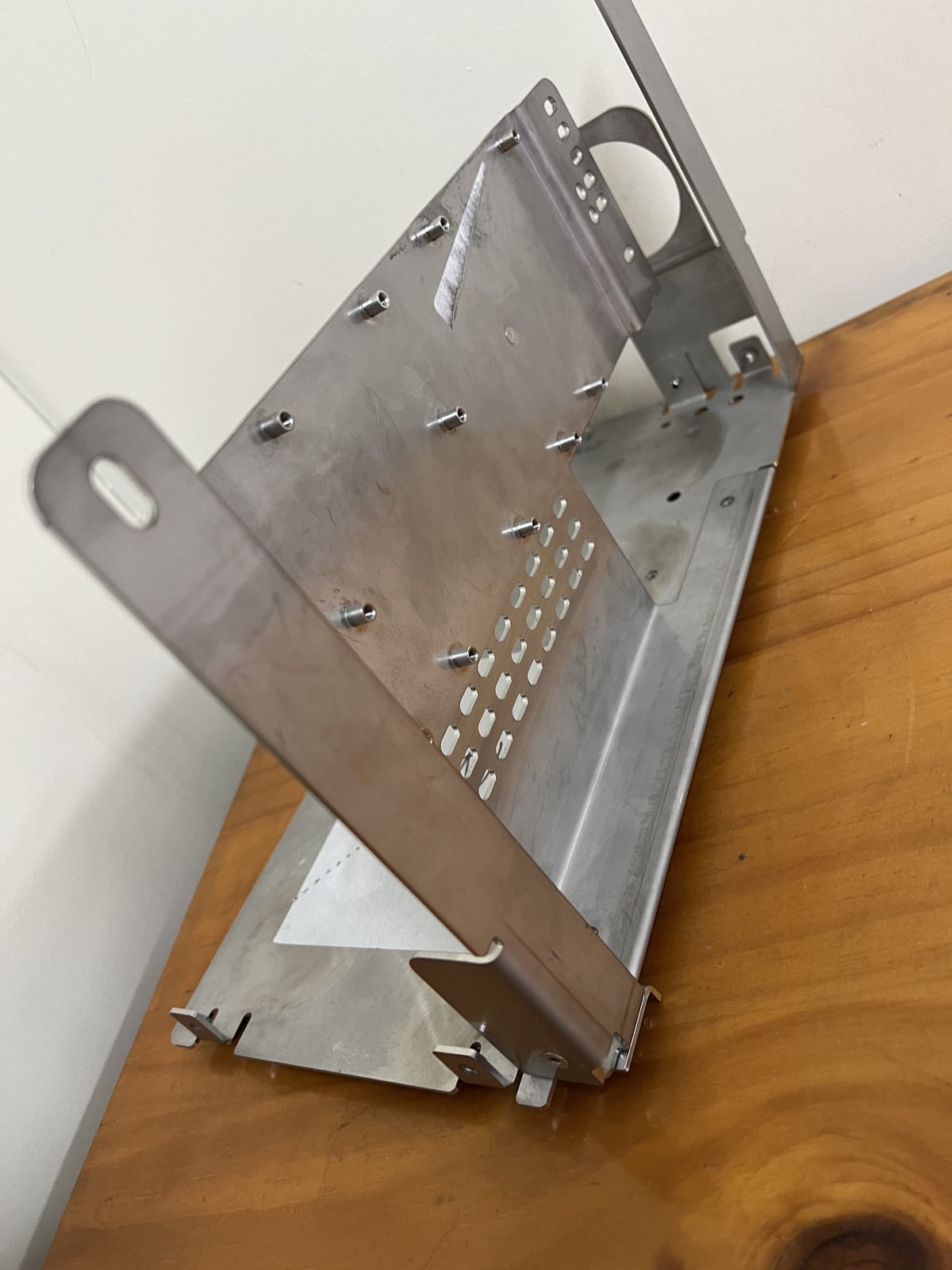 Precision chassis with punched louvre pattern and PEM inserts
